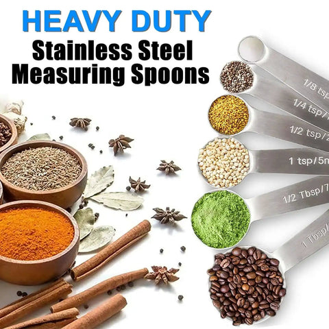 Heavy duty stainless steel measuring spoons with metric and US measurements for dry and liquid ingredients, spices displayed in bowls