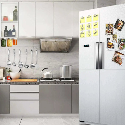 Kitchen scene with a fridge displaying notes secured by Six Pack Super Strong Neodymium Disc Magnets With Double Sided Adhesive.