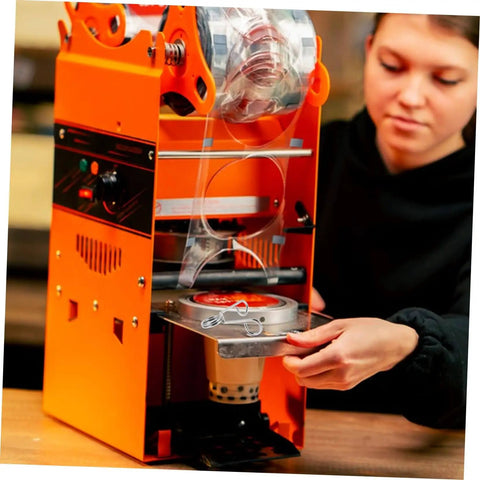 Person installing 10 Piece Stainless Steel Spring Clips For Cup Sealing Machines Universal Replacement Accessories on a machine