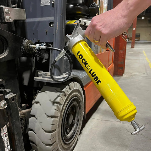LockNLube premium pistol-grip grease gun with 20in hose and inline swivel, yellow body connected to forklift fitting.