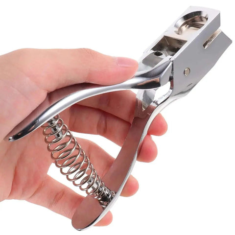 Compact Manual Oval Hole Puncher For IDs And Office Paper, Rugged Metal Single Hole Punch Tool in hand view