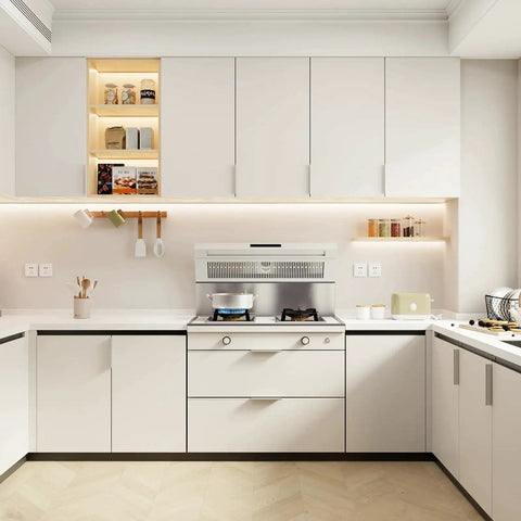 Modern kitchen with white cabinets and sleek design, featuring a clean countertop and under-cabinet lighting for a minimalist look.