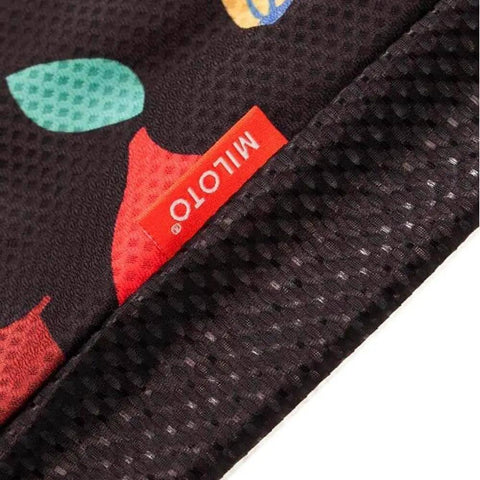 Close-up of fabric texture with colorful design and MILOTO label