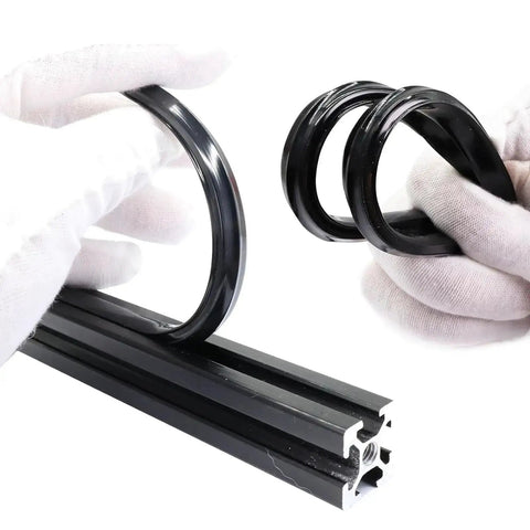 Hands holding black Dust Protection Soft Cover Seal Strip for 3030 and 4040 series 8mm slot aluminum profile extrusion.