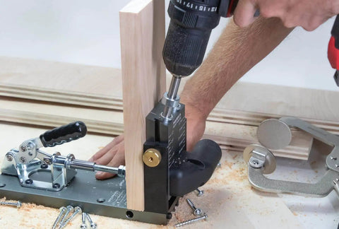 Person using Aluminum Pocket Hole Jig System Pro M2 Adjustable And Easy To Use Joinery Woodworking Tool with a drill
