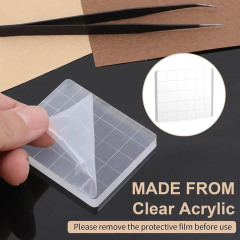 Six Clear Acrylic Stamp Blocks Set with grid lines shown with protective film being removed, ideal tool for DIY projects.