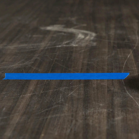 Clean Release Blue Painter's Tape 0.94 Inch Wide 60 Yards For Sharp Lines placed on a wooden surface