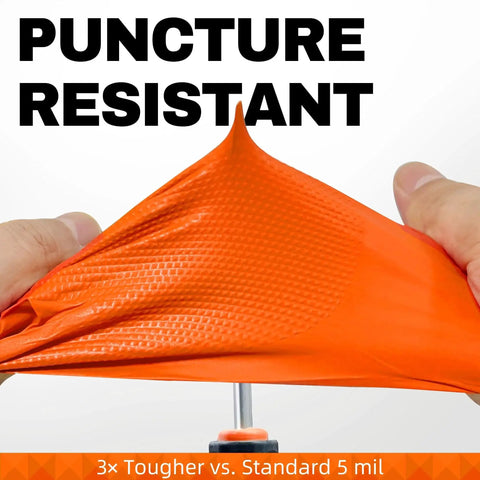 Close-up of hands stretching 8 Mil Nitrile Disposable Gloves Heavy Duty Diamond Textured Orange Large 50 Pcs, showing puncture resistance.