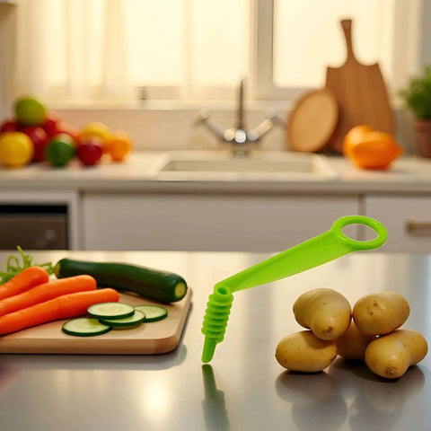 Green Spiral Slicer Portable Manual Kitchen Gadget For Cucumber Carrot And Potato Garnishes on kitchen counter with vegetables
