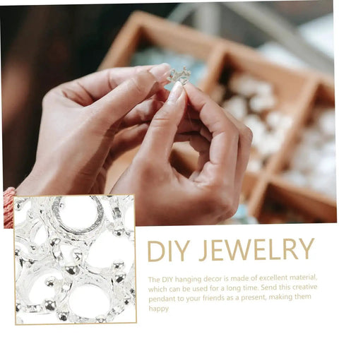 Person holding one of the 60 Pcs Crown Charms For Jewelry Making Tiara Pendants Alloy Crowns Beads Ideal For Earrings Bracelets Key Rings And DIY Craft Projects Vintage Crown Shaped Beads For Every Accessory.