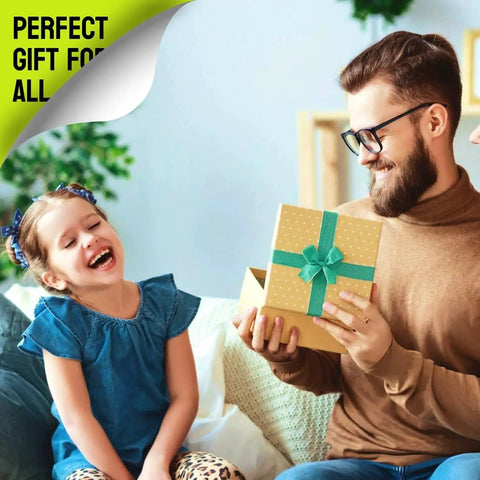 Man giving a yellow gift box with turquoise ribbon to a young girl in a cozy living room setting.