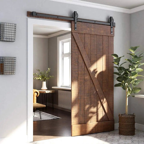 Heavy Duty Sliding Barn Door Hardware Kit In Black for smooth operation, installed on wood door, in a home setting