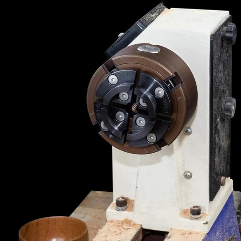 Four Inch Wood Lathe Chuck Set With 1 Inch By 8 TPI Thread And Three Quarter Inch By 16 TPI Adapter Built Tough Self Centering Four Jaw Wood Turning Chuck Heavy Duty Rust Resistant CNC Processed For Stable Holding And Easy Gripping on lathe.