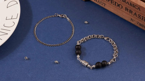 Two bracelets with Antique Silver Tibetan Style Pumpkin Spacer Beads 4mm, 100 Piece Set for DIY Jewelry Making on a blue background.