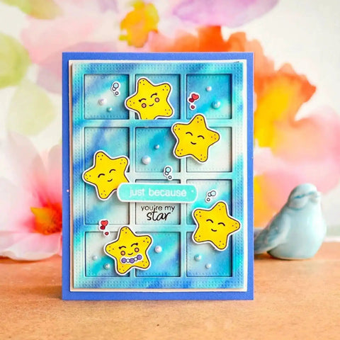 Handmade card with yellow star embellishments and blue background, featuring 'Just Because You're My Star' text, floral accents.