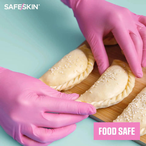 Hands wearing Magenta Nitrile Gloves 2.0 Mil Large Disposable Powder Free All Purpose 100 Ct preparing food