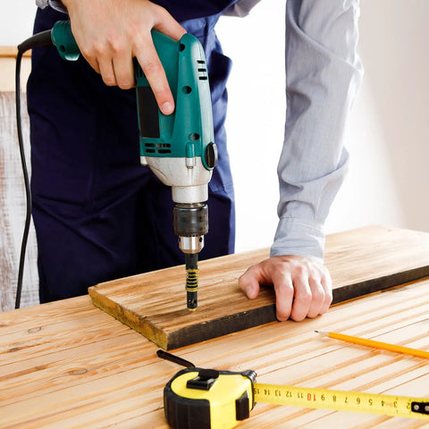 Person using drill with Self Centering Hinge Drill Bit Set 3 Pc With 5mm And One Quarter Inch Hex Shank Bits For Wood And Plastic Reaming