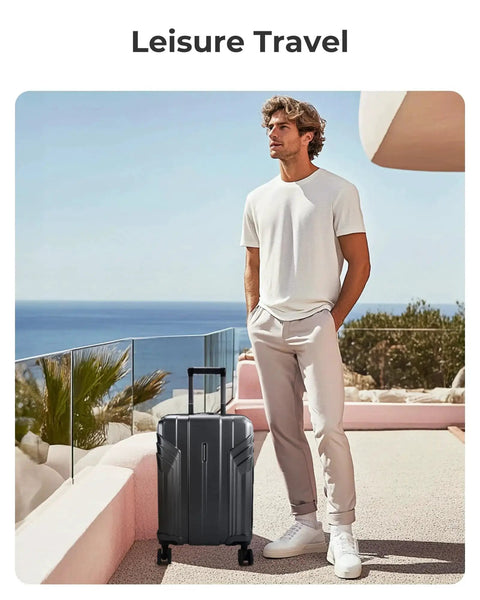 Gray expandable carry on luggage airline approved 22x14x9 inches, 35 liter capacity, ultra lightweight with spinner wheels next to a person.