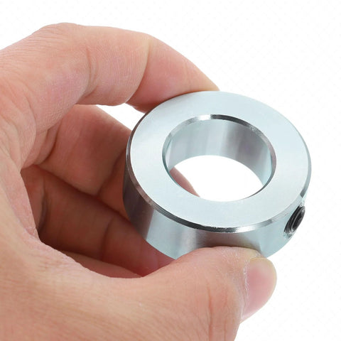 Zinc plated carbon steel set screw shaft collars with a 15/16 bore, 1-5/8 outside diameter and 9/16 inch thickness in hand.