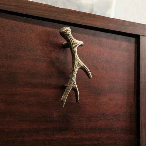 Antique Bronze Finish Cast Iron Deer Antler Drawer Pulls Set Of Six For Cabinets, installed on a wooden cabinet drawer.