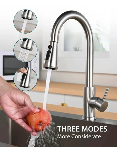 Pull Down Sprayer Kitchen Faucet In Brushed Nickel High Arc Design with a hand washing fruit, three spray modes visible