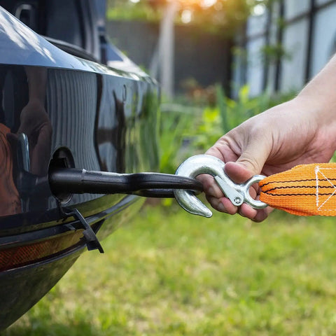 Person attaching orange strap to clevis hook on car towing hitch using Two Pack 1.7 Inch Hook Safety Latch Kit For Clevis Hooks And Towing Hitches.