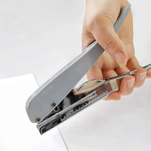 Hand using Heavy Duty One Hole Punch For Crafting And Card Making, Portable Handheld Paper Puncher With One Quarter Inch Hole Size on paper