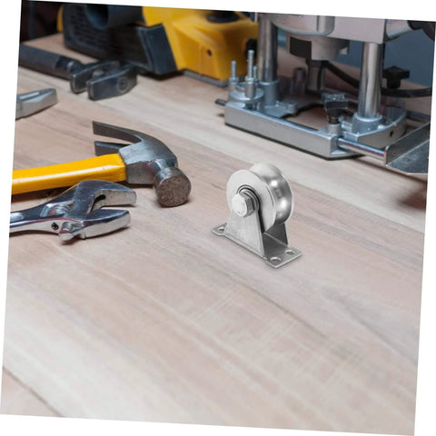 Stainless Steel Groove Wheel Pulley For Sliding Doors And Barn Doors Heavy Duty Track Wheel on a wooden surface with tools