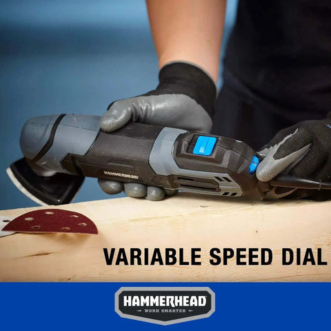 Person using Versatile 2 2 Amp Oscillating Multi Tool Kit With Flush Cut Blade for precise cutting on wood