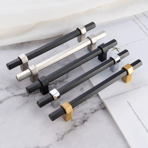 Ten Pack 3 Inch Hole Center Black And Gold Cabinet Pulls Matte Black Hexagon Bar With Brushed Gold Bases on marble