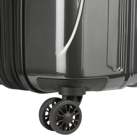 Close-up of lightweight expandable hardside luggage with four double spinner wheels and a crack resistant polycarbonate shell in brushed charcoal.