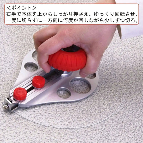 Hand using Beefy Aluminum Die Cast Circle Cutter with adjustable 1.18 to 10.23 inch cutting diameter on textured surface.