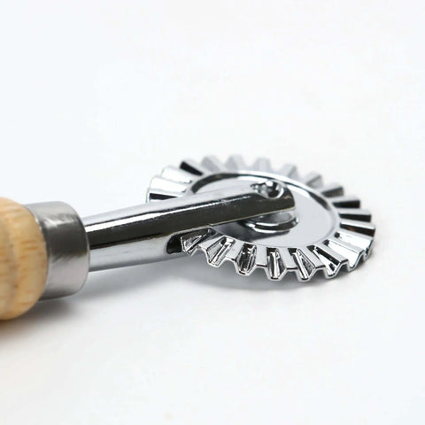 Close-up of 2 Piece Zinc Alloy Crinkle Cutter Set With Long Wooden Handle For Pizza Wheel And Ravioli Press Perfect For Making Pasta