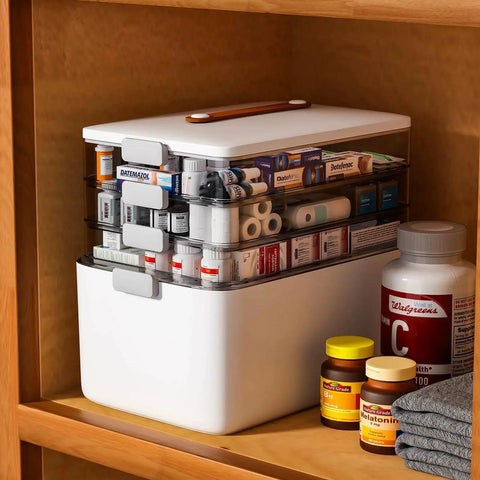 Four Tier Portable Medicine Storage Box Organizer With Handle For Home Travel First Aid Kit in a shelf, showing filled compartments.
