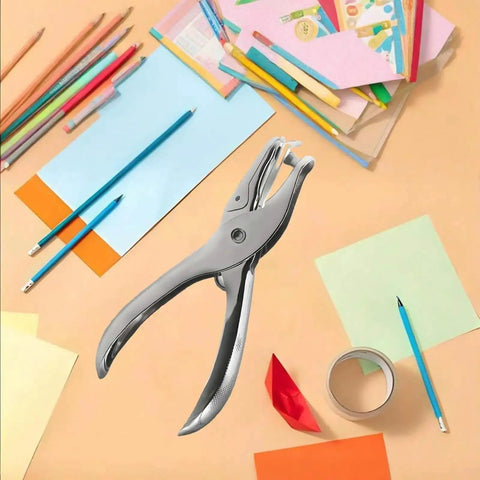 Handheld 6mm Circle Hole Punch Single Hole Puncher Metal Craft Punch Tool with handy non slip grip, paper and craft supplies in background