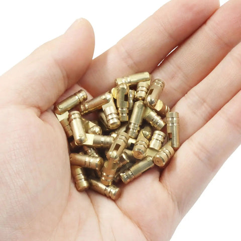 Hand holding Concealed Brass Barrel Hinges Set For Jewelry Boxes And Woodworking Projects 50 Pieces 25x5mm Gold Brass Invisible Hinges.