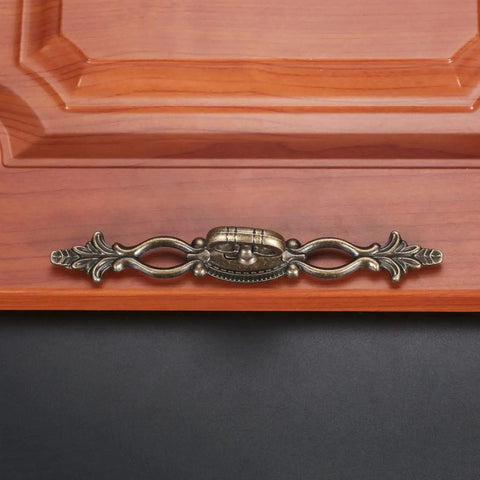 Vintage Style Antique Bronze Cabinet Pulls Handles on Wooden Drawer