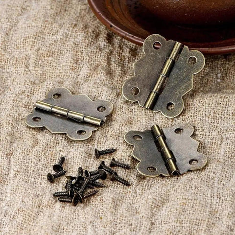 40 Pieces Antique Bronze Butterfly Hinges For Tiny Jewelry Boxes, Dollhouse Cabinets, And Miniature Woodworking Projects, 20 By 17 Mm Iron Hinges With Rust Resistant Plating And Included Screws shown on burlap surface.