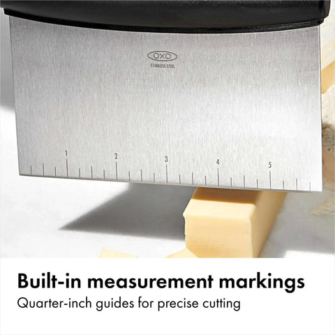 Stainless Steel All Purpose Scraper and Dough Cutter with Built In Quarter Inch Markings, chopping butter block in kitchen