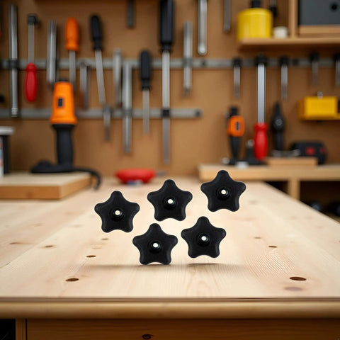 Five Pack Black Star Knobs For T Track Bolts And Feather Boards, 5/16-18 Female Thread, on a wooden workbench.