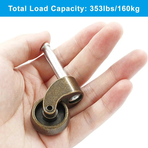 Close-up of Antique Brass 1 Inch Swivel Stem Ball Caster Wheel, shown in hand to demonstrate size, zinc alloy material.