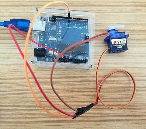 Geekstory Feetech FS90R blue continuous-rotation micro servo with RC tire wheel and orange wires (front view)