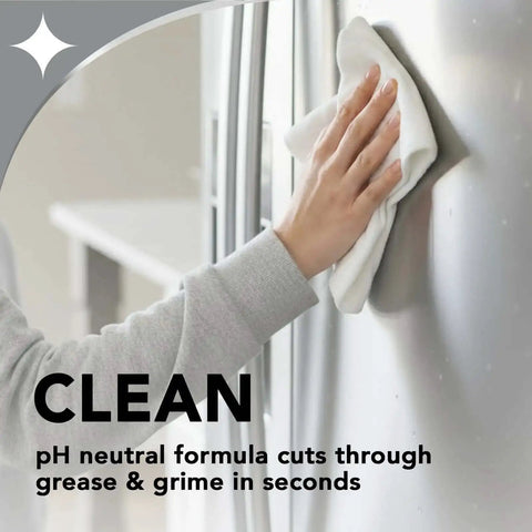 Person cleaning refrigerator with cloth and Stainless Steel Cleaner And Polish Spray Aerosol 2 Pack For Appliances, Chrome And Sinks.