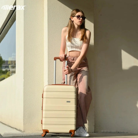 Woman with Tough As Nails 3 Piece ABS Hardside Luggage Set With Spinner Wheels Lightweight Yet Durable Carry On 20 Inch Suitcase