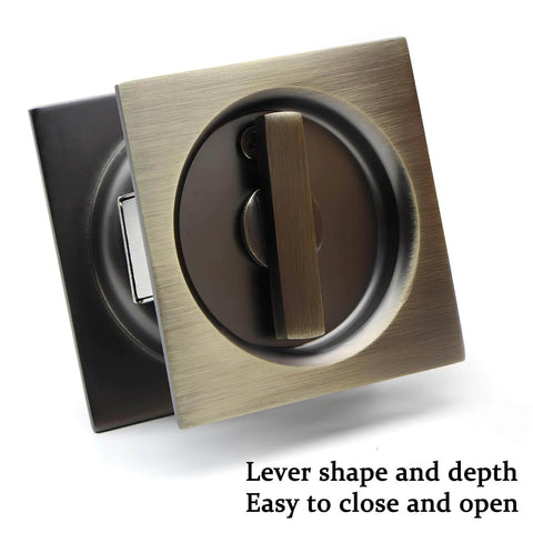 Front view of Privacy Pocket Door Lock And Pull In Stainless Steel 304 With Antique Brass Finish Emergency Unlock Feature