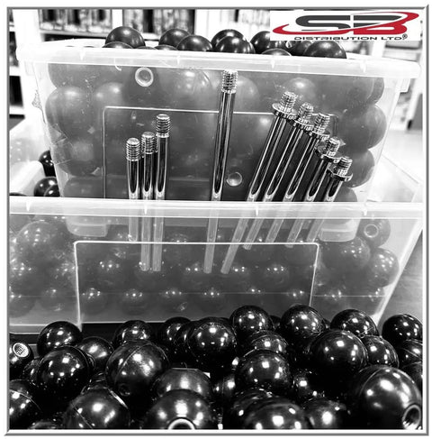 Bins filled with Heavy Duty Black Phenolic ABS Female Ball Knob With Brass Insert 3/8-16 Thread and metal rods.