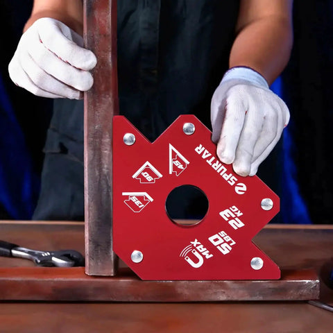Person using Heavy Duty Welding Magnets Set 50 Lbs Each Four Pack With Clamps For Hands Free Welding Magnetic Holder Squares for positioning metal at 90 degrees.