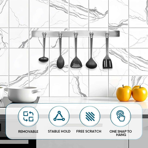Kitchen holder with hanging utensils against a tiled backsplash, featuring removable, stable hold, free scratch, and one snap to hang features.