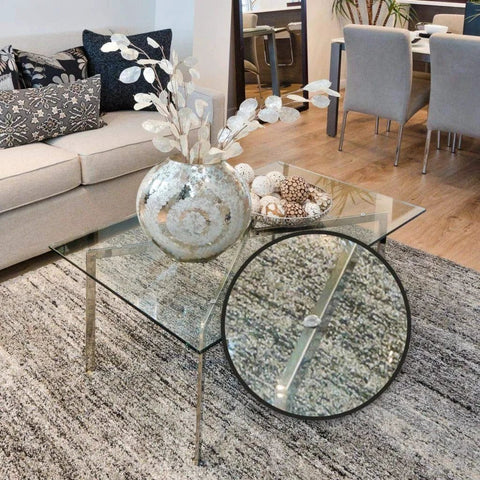 Glass tabletop with 100 Clear Cabinet Door Bumpers Half Inch Self Adhesive Rubber Feet Pads for surface protection and noise dampening.