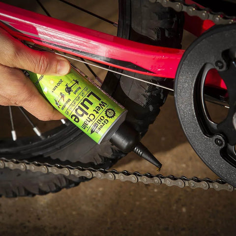 Applying Palm Oil Free Bike Cleaner And Wet Chain Lube Bundle For All Weather Riding Made In UK With A Non Freezing Formula to bike chain